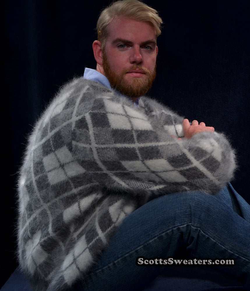 Men's argyle angora cardigan sweater in gray and white three-tone pattern worn by a seated man