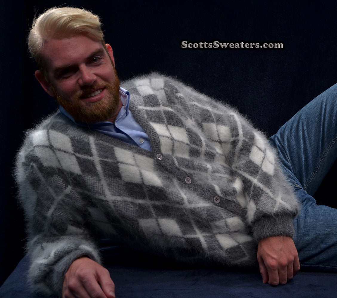 Men's argyle angora cardigan sweater in soft gray and white three-tone pattern worn by man reclining
