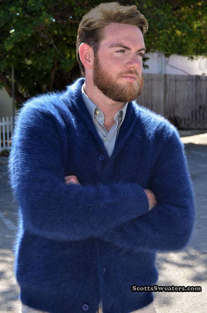 Men's solid-color royal blue angora cardigan sweater with shawl collar and double-thickness knit, worn by a bearded man outdoors