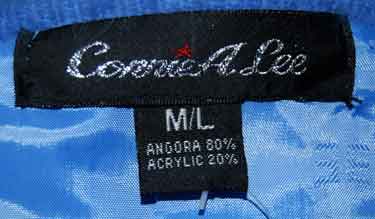 Woman's powder-blue angora cardigan sweater with pockets by Connie A. Lee