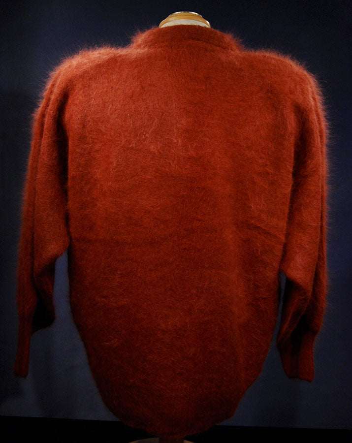 Woman's angora polo-neck sweater in rust color, soft and fuzzy pullover design