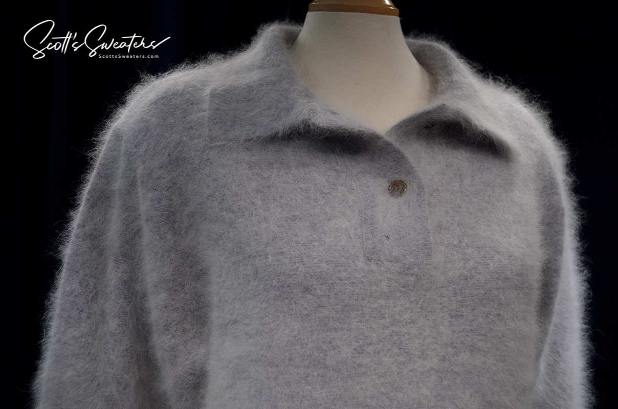 Grey woman's angora polo-neck sweater with soft fuzzy texture and single button detail