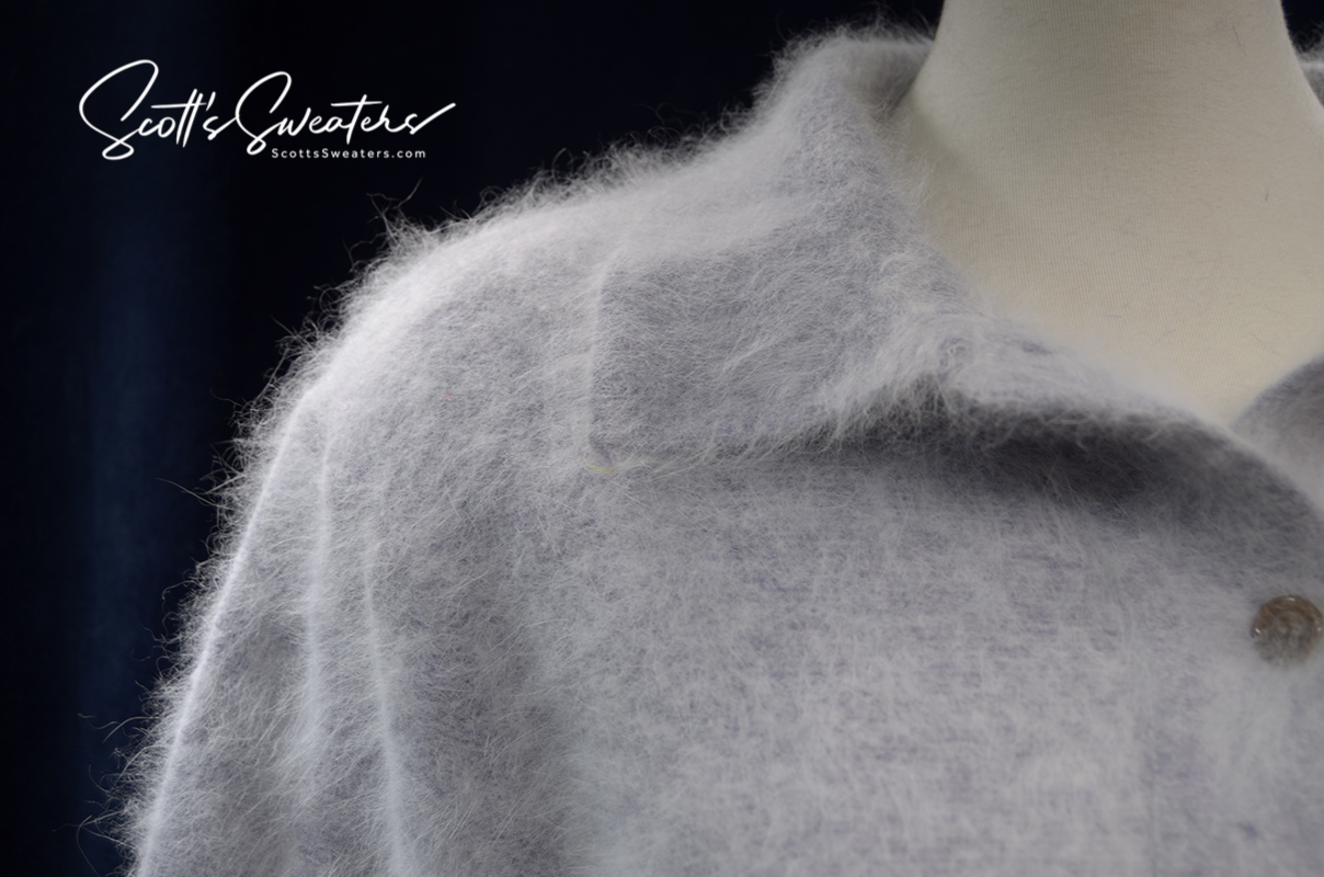 Woman's Angora Polo-neck sweater in soft grey angora wool on mannequin with buttons visible