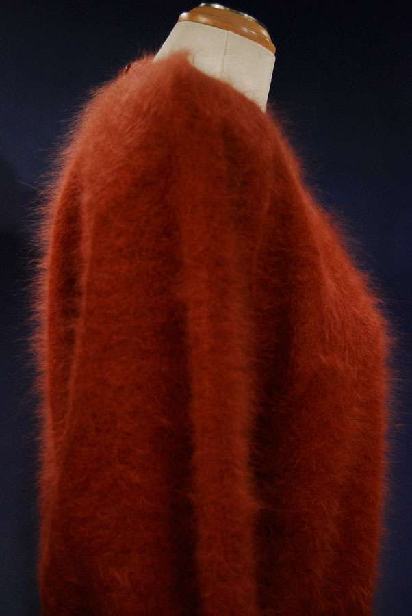 Brick-red woman's angora jewel-neck sweater by Connie A Lee displayed on mannequin