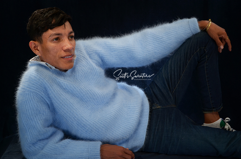 Men's soft luxurious light blue angora rib-knit sweater with V-neck and relaxed fit worn by male model