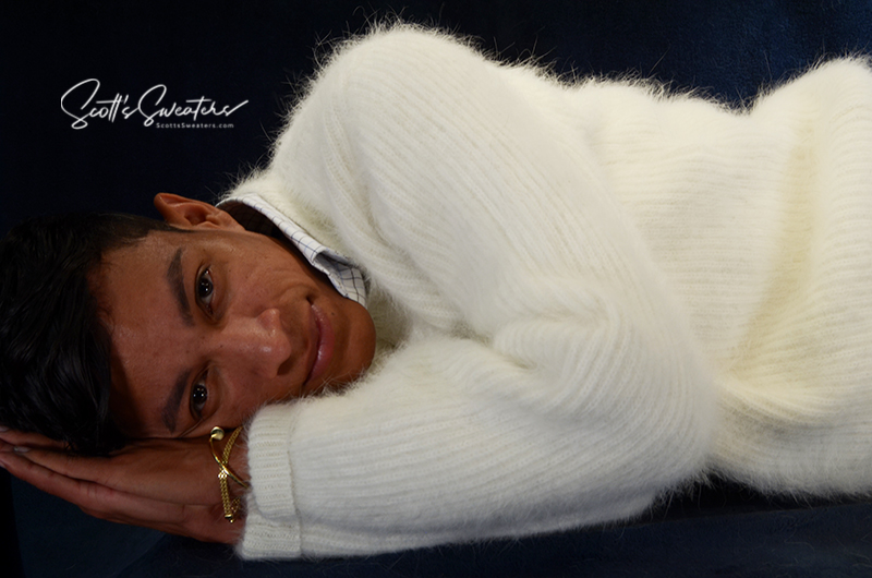 Men's soft luxurious white angora rib-knit V-neck sweater model lying down