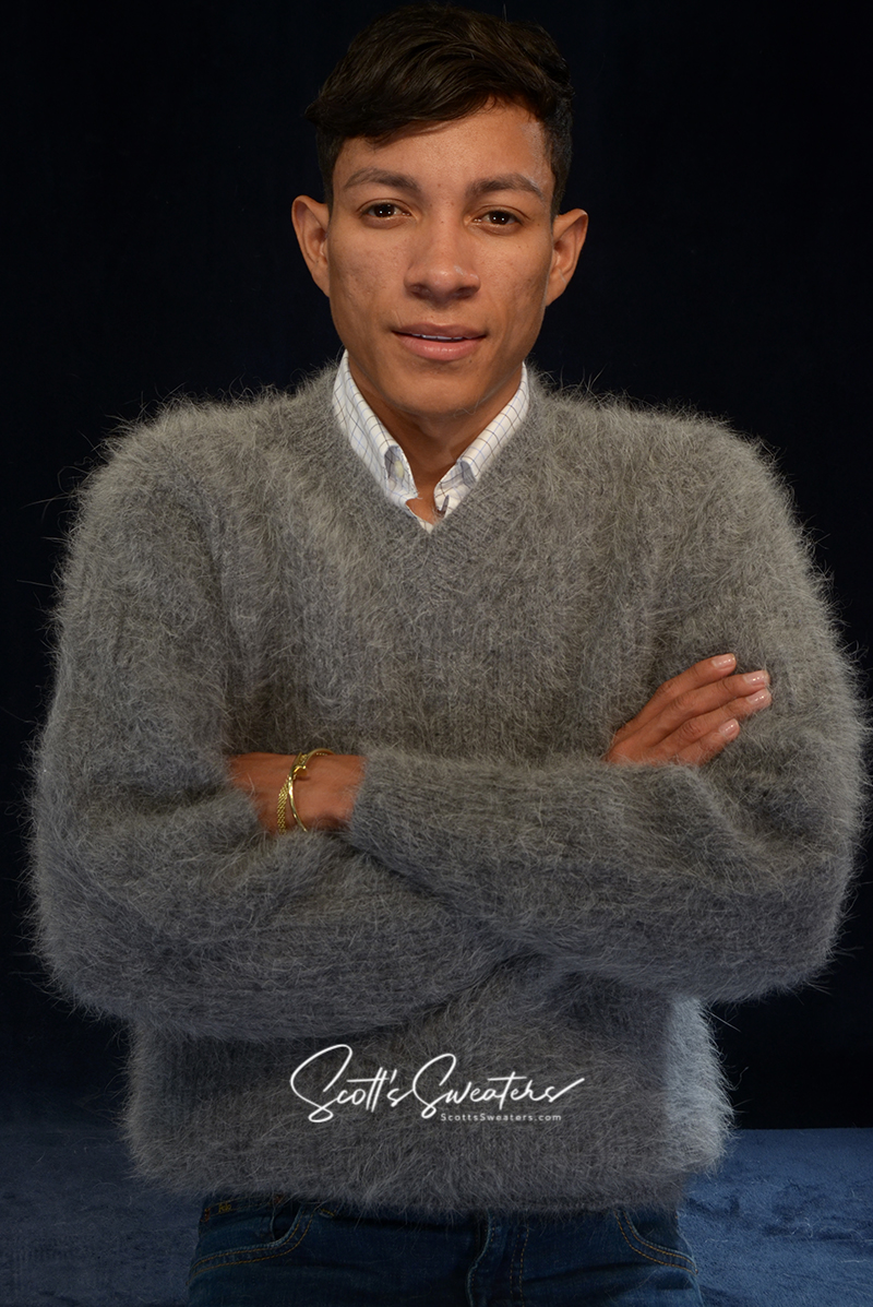 Men's soft luxurious gray angora sweater with rib-knit design and V-neck style worn by model.