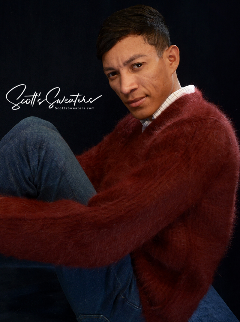 Men's soft luxurious angora sweater in deep red with rib-knit design and V-neck collar.