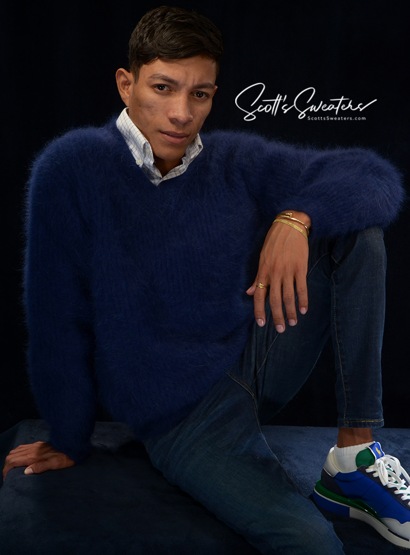 Men's soft luxurious angora sweater in navy blue with rib-knit design and V-neck collar worn by model