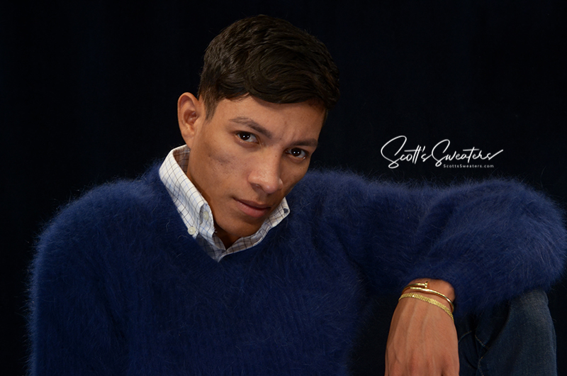 Men's soft luxurious angora sweater in blue with rib-knit design and V-neck collar worn by model