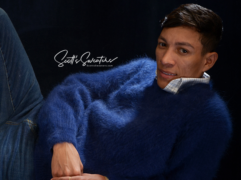 Men's soft luxurious blue angora sweater with rib-knit design and V-neck collar modeled by man