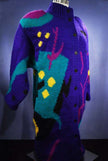 Woman's brightly colored wool sweater-coat with desert motif and button-up front