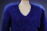 Woman's blue speckled mohair V-neck sweater with red, green, yellow, and blue knit-in specks, size small-medium