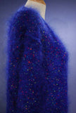 Woman's blue speckled mohair V-neck sweater with colorful knit-in specks on mannequin