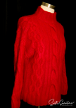 Red woman's cabled mock-turtleneck sweater made of angora and lambswool blend