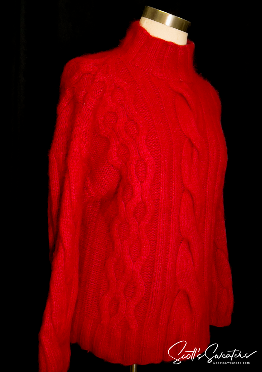Red woman's cabled mock-turtleneck sweater made of angora and lambswool blend