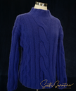 Purple woman's cabled mock-turtleneck sweater made from angora and lambswool blend