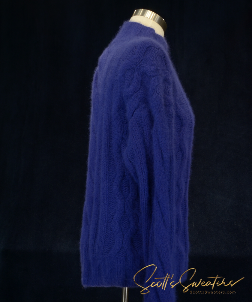 Soft blue woman's cabled mock-turtleneck sweater made of angora and lambswool blend