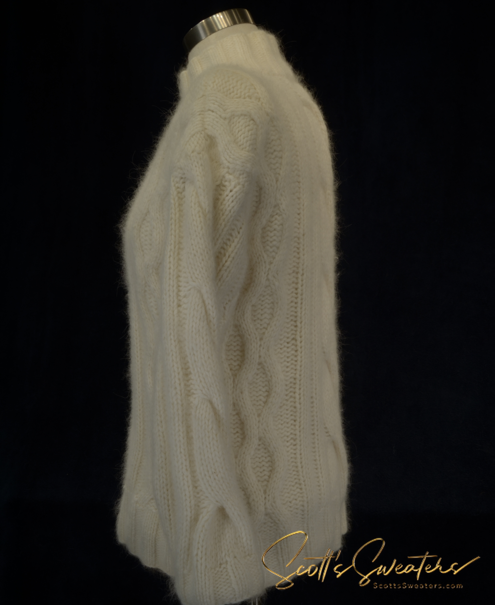 White woman's cabled mock-turtleneck sweater made of angora, lambswool, and nylon blend doux soft knitwear