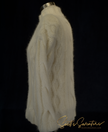 White woman's cabled mock-turtleneck sweater made of angora, lambswool, and nylon blend doux soft knitwear