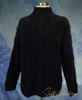 Woman wearing a cozy cable knit mock-turtleneck sweater made of angora and lambswool