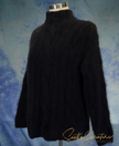 Black woman's cabled mock-turtleneck sweater made of angora and lambswool blend on mannequin