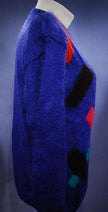 Woman's colorful deep V-neck jewel-tone geometric pullover sweater by Nell Flowers in small size
