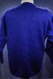 Woman's colorful deep V-neck jewel-tone sweater with geometric design by Nell Flowers shown from back