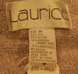 Close-up of Laurice label and fabric tag on woman's medium grey silk-angora cardigan sweater