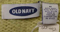 Woman's pale-green wool-acrylic turtleneck sweater by Old Navy with size tag showing medium but fits x-small to small