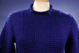 Woman's dark-blue hand-knit wool-acrylic rollneck sweater in navy blue on mannequin