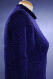 Woman's dark-blue hand-knit wool-acrylic rollneck sweater on mannequin side view