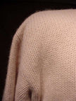 Close-up of a soft pink angora lambs wool sweater for women by The Limited in size small