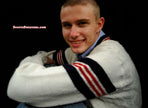 Men's retro cable-knit V-neck tennis sweater with sporty stripes by Interwoven