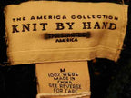 Woman's emerald-green 100% wool mock-turtleneck sweater label by Knit By Hand
