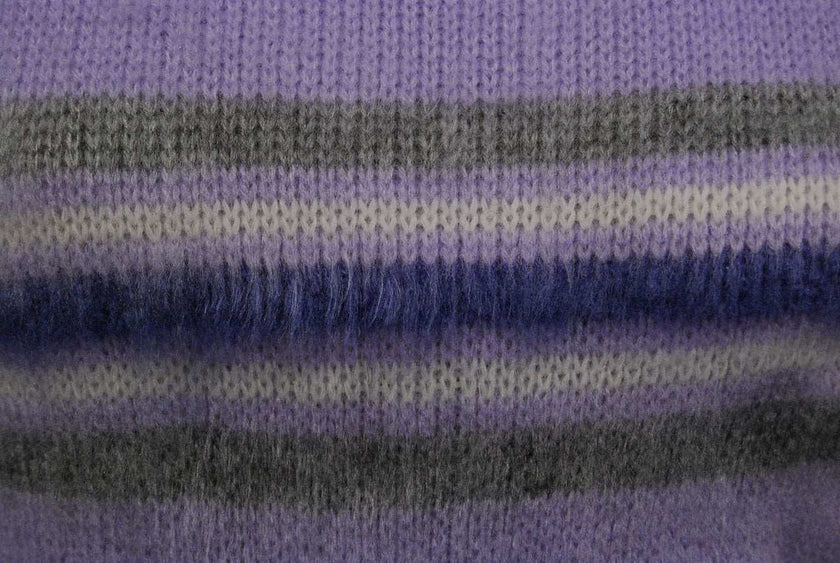 Close-up of girl's purple brushed acrylic crewneck pullover fabric with gray and navy stripes