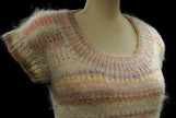 Hand-knit round-neck sleeveless sweater vest in white with soft pastel horizontal stripes for women or girls spring and summer wear