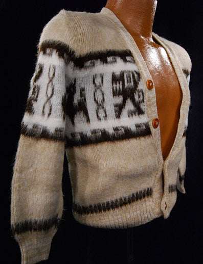 Small boy wearing soft tan alpaca cardigan sweater with button front