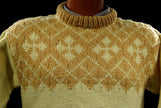 Child's pale-yellow hand-knit wool-acrylic sweater with coffee colored neck and chest design