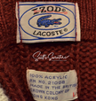 Men's classic retro burgundy Izod Lacoste tennis sweater label with blue crocodile logo and acrylic fabric details