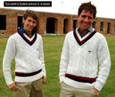 Two men wearing men's classic retro Izod tennis sweaters with burgundy and navy adjacent neckband stripes outdoors