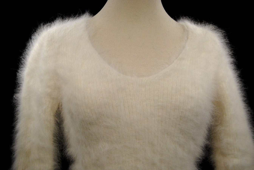 Woman's sexy cropped 3/4-sleeve angora sweater in soft ivory white