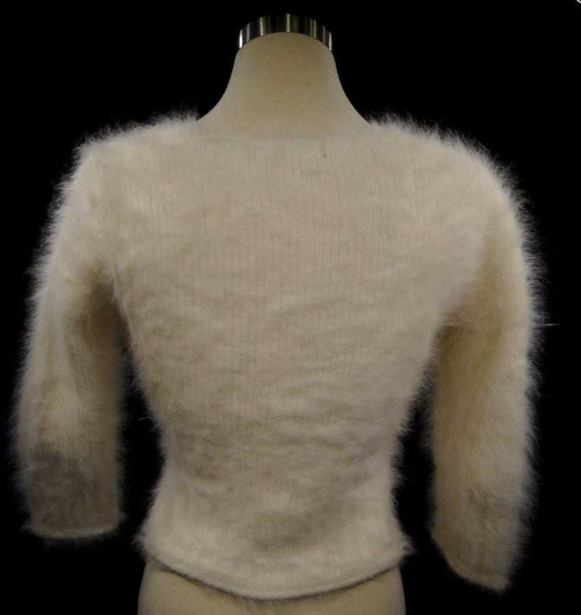 Woman's sexy cropped 3/4-sleeve angora sweater in beige with fuzzy texture and cling-fit design