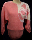 Woman's beaded-pink angora sweater with large white floral design on left shoulder by David Brett size 36