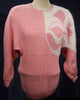 Woman's pink angora sweater with large white beaded design on left shoulder by David Brett, size 36