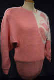 Woman's beaded-pink angora sweater with large white beaded design on left shoulder by David Brett, size 36