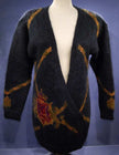 Woman's long black mohair cardigan sweater with metallic gold crest design by Linda Alland for Ellen Tracy