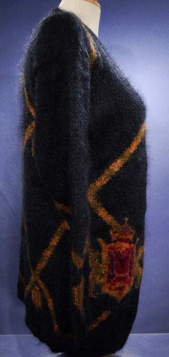 Woman's long black mohair cardigan with metallic gold crest design by Linda Alland for Ellen Tracy, size P (40)