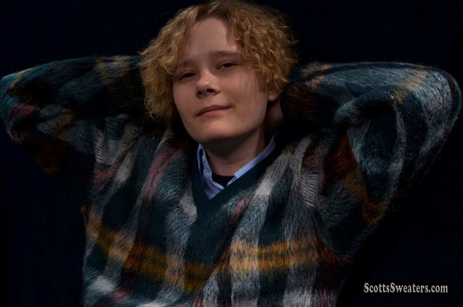 Vintage mohair sweater with retro shaggy plaid and V-neck design worn by a model