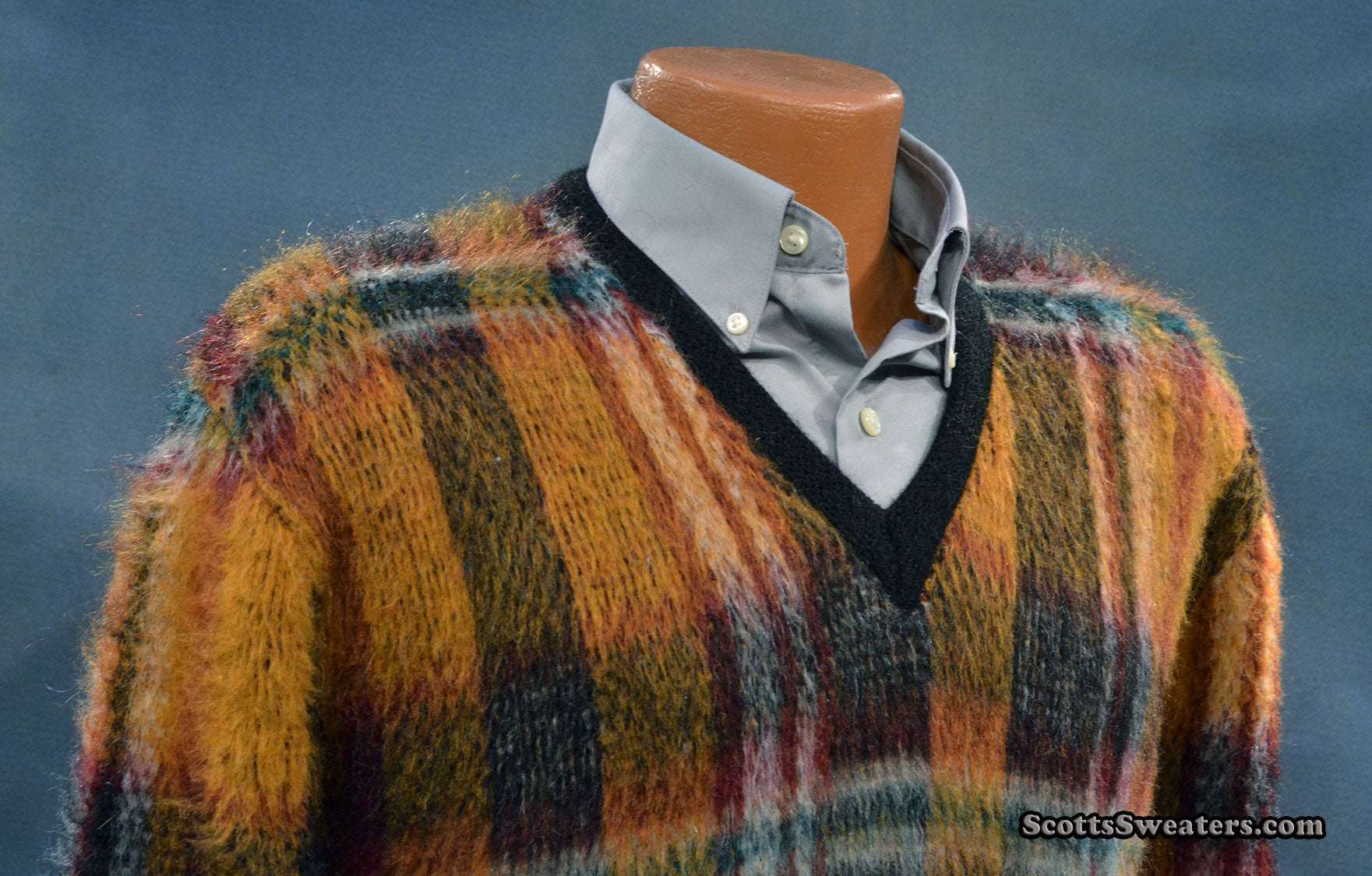 Vintage mohair sweater with retro shaggy plaid design and V-neck style on mannequin